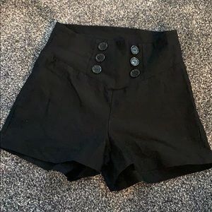 Black stretchy short-shorts with decor. buttons